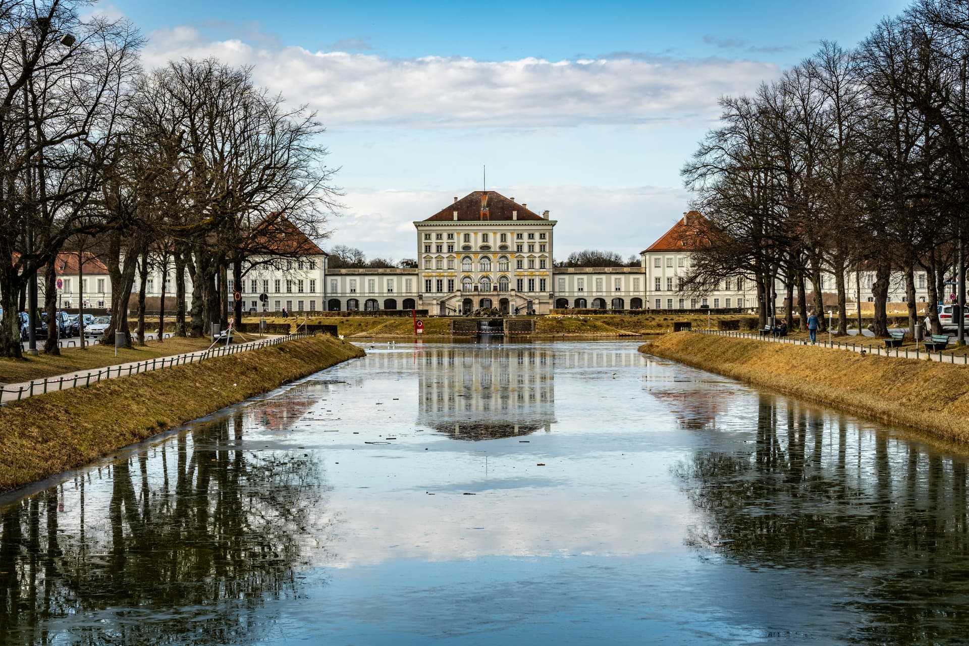 a large building sitting next to a body of water