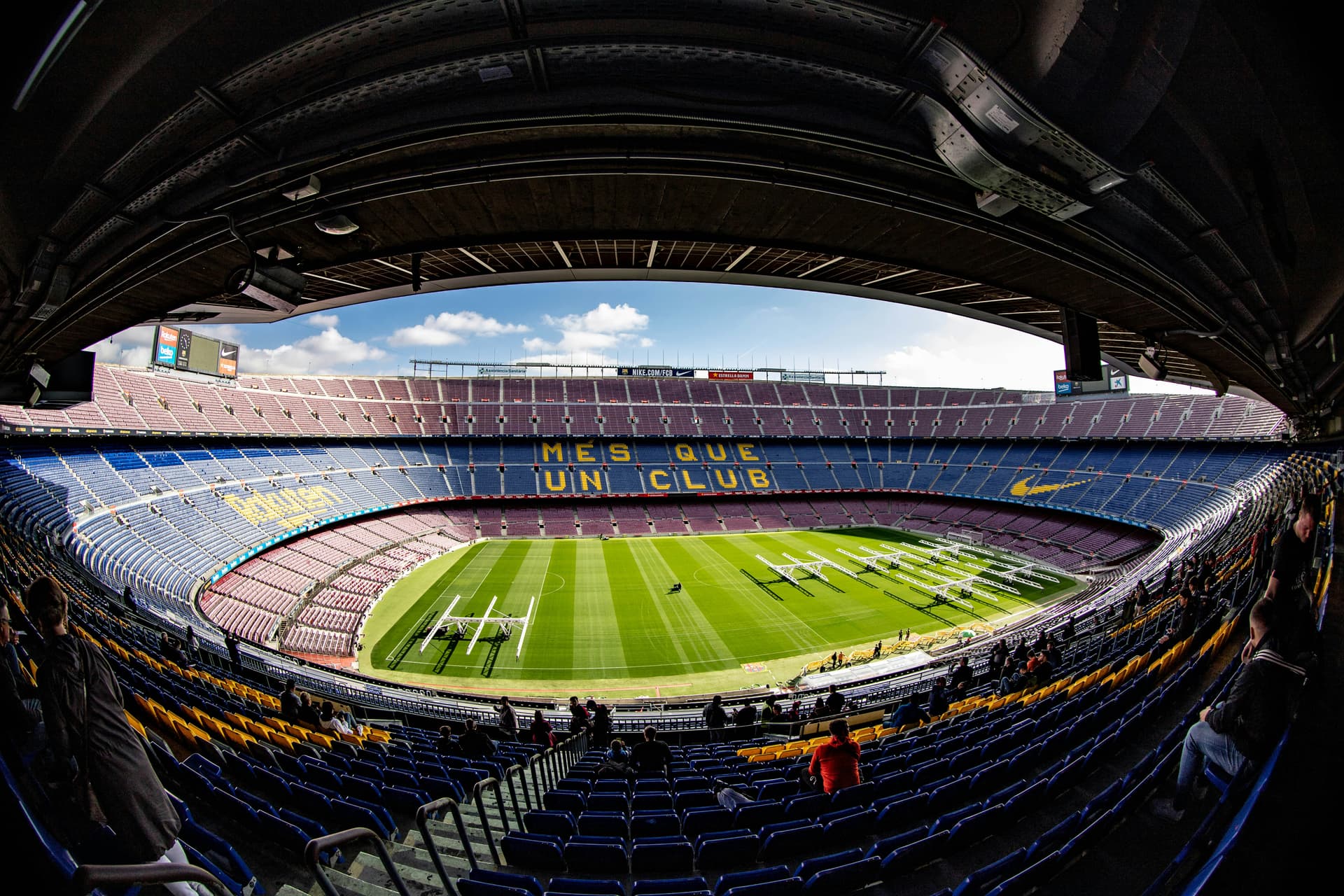 a large stadium with a green field