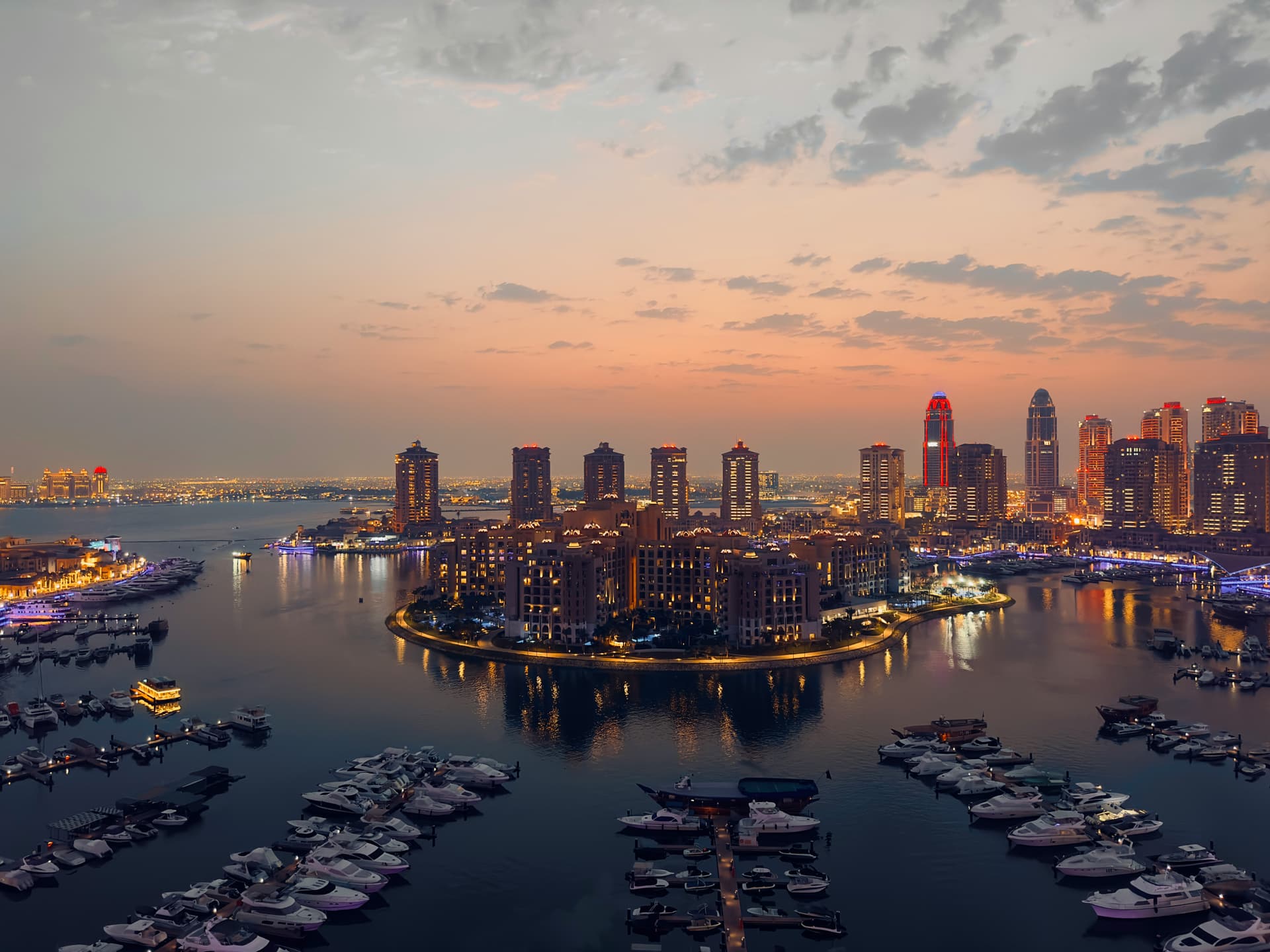 Capturing at sunset time enhances the beauty of building lights as the sunset's shine adds to their allure.